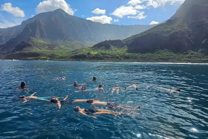 a body of water with a mountain in the background