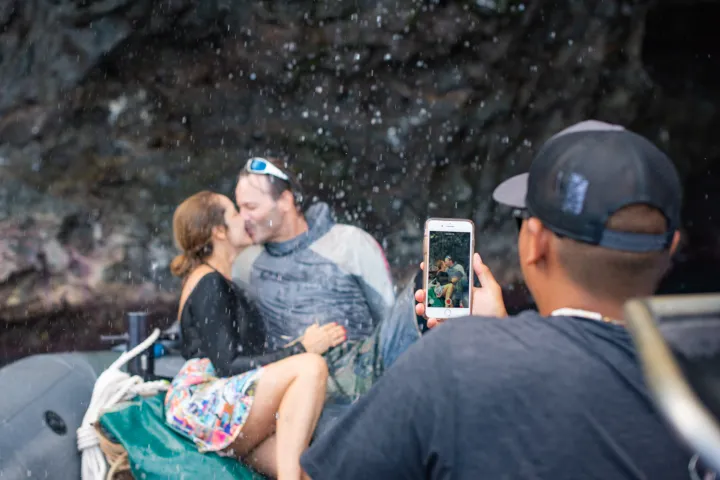 a group of people sitting on a bench
