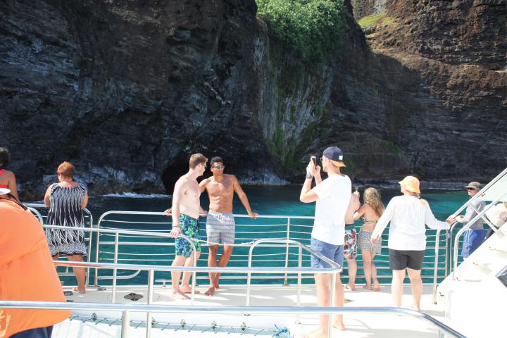 a group of people standing on top of a mountain