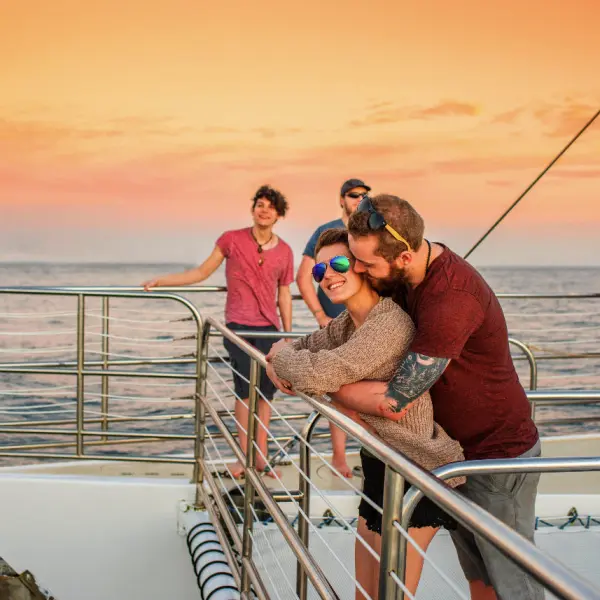 couple on a sunset boat tour with Kauai Sea Tours