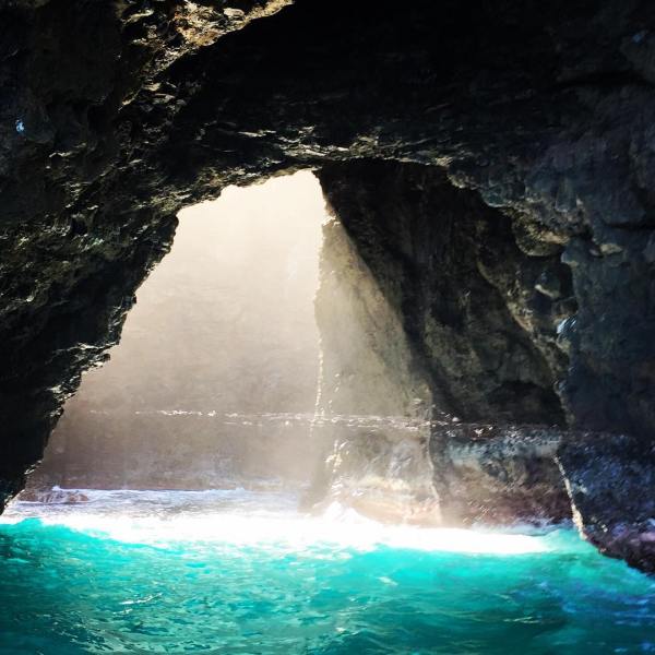 a large waterfall over a body of water
