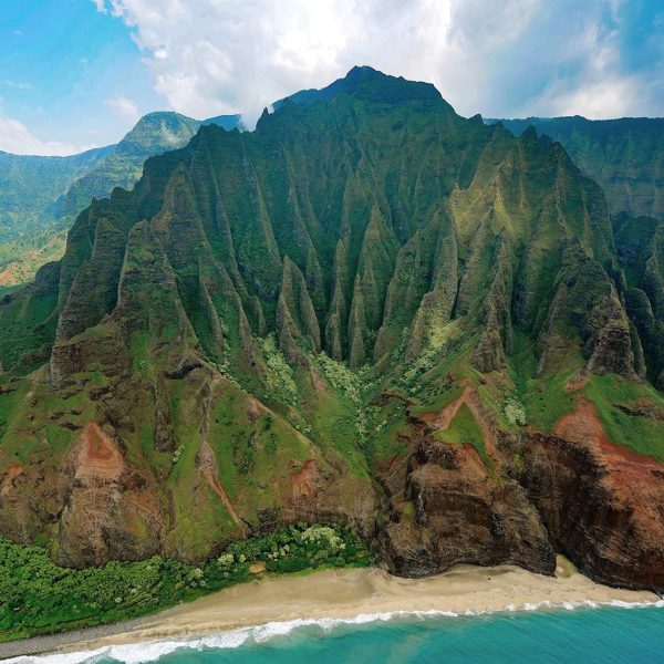 a body of water with a mountain in the background