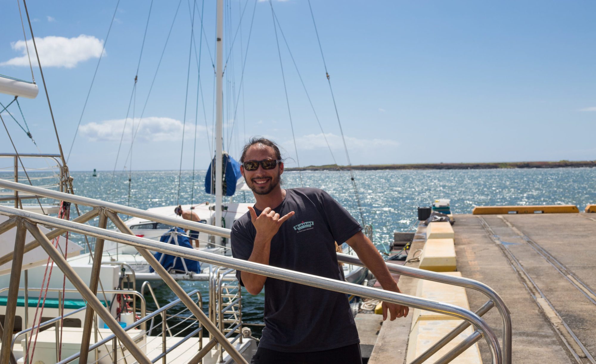 a guy on a boat in the waters of Kauai captain-of-boat-on-kauai