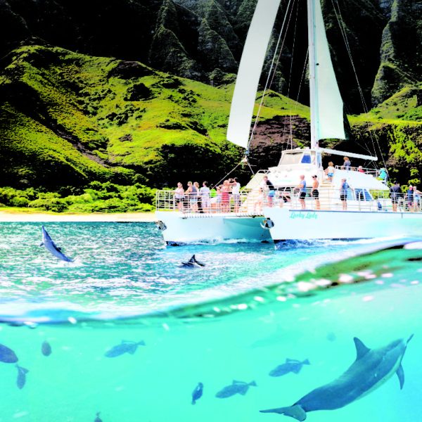 a large body of water and boat in kauai