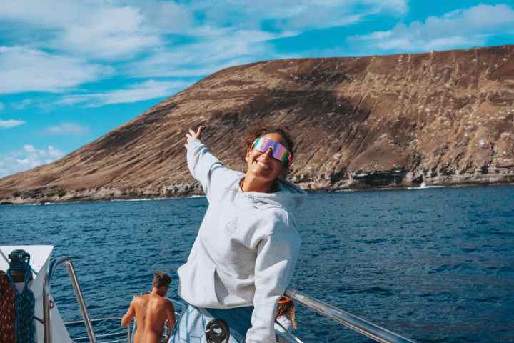 a person standing in front of a body of water