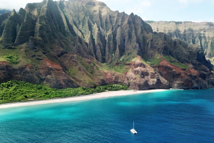 a body of water with a mountain in the background