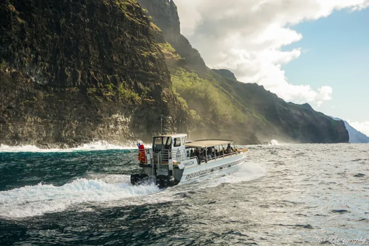 a large body of water with a mountain in the background