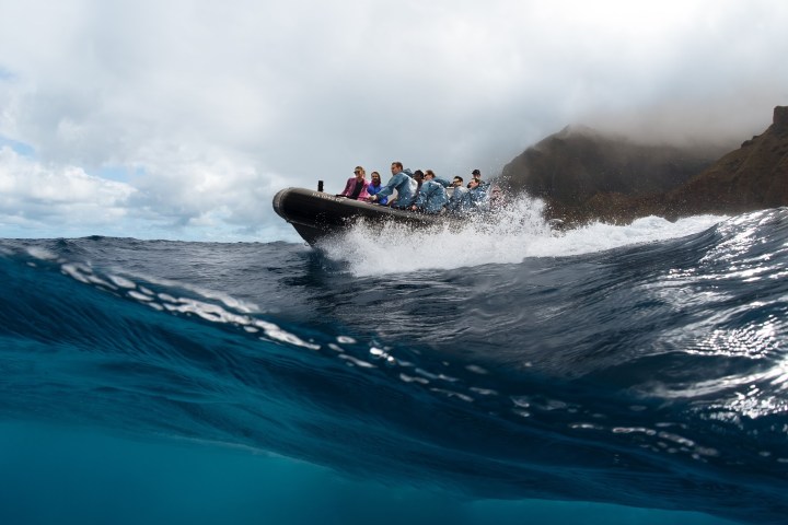 a man riding a wave on top of a body of water