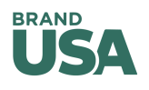 Logo with text 'BRAND USA' in green, white triangle inside the letter 'A'.