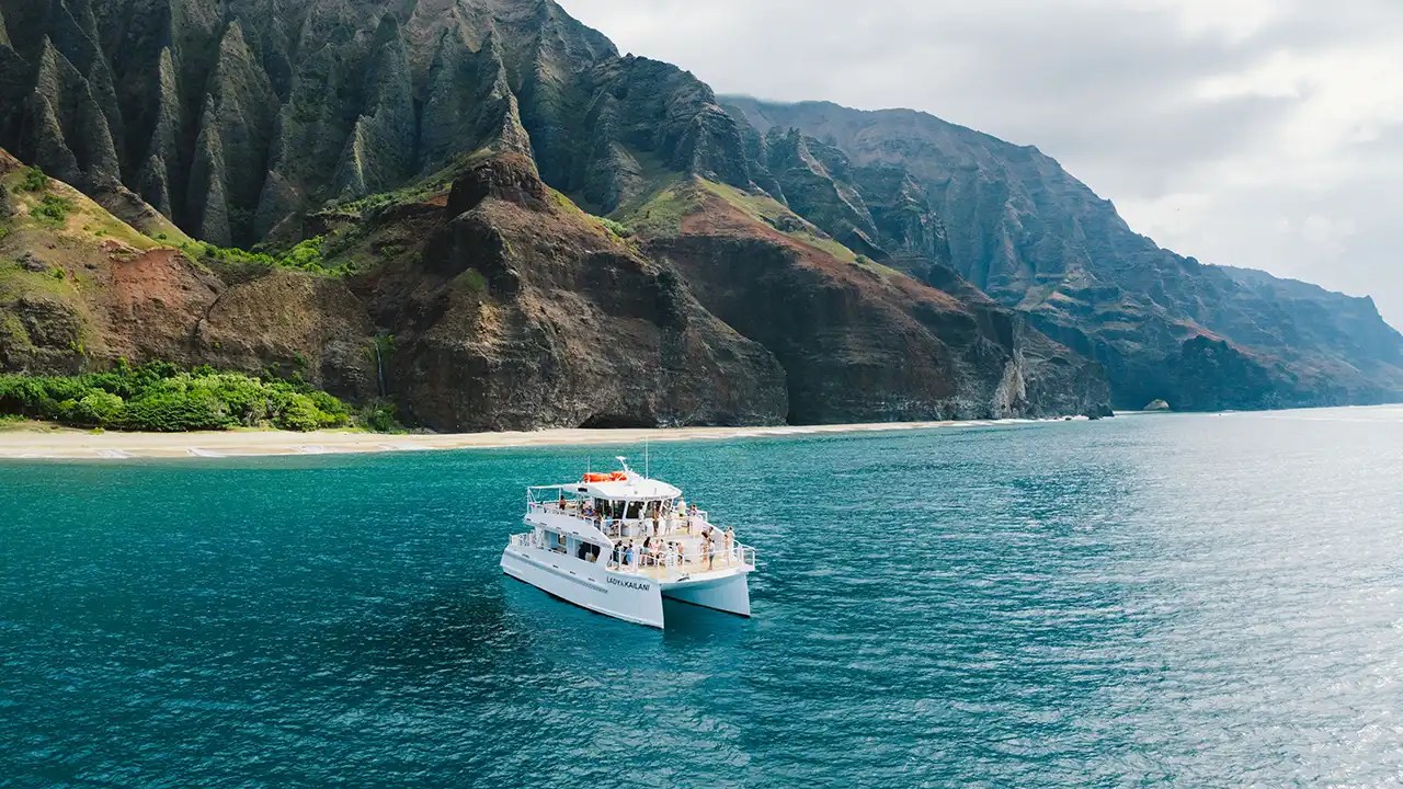 cliffs rising from the shoreline of the na pali coast best seen by boat
